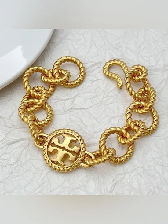 Tory Burch Twisted Link Logo Charm Bracelet in Gold - Picture 1 of 4